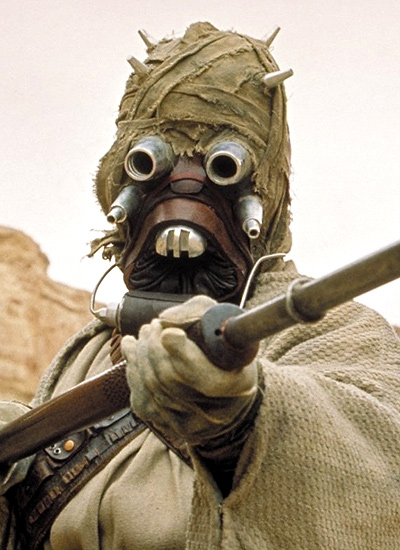 TUSKEN RAIDERS
The tramps of the Galaxy, the Tusken Raiders invariably spent their time lounging around rock crevices in Tatooine, forever sporting their ridiculous woolen smocks in what we'd imagine was a fairly humid environment. Never ones to do much 'raiding', these odd looking creatures really come into their own on 'Podrace Day', where an afternoon would be spent taking incredibly accurate pot shots at the passing racers - often killing the poor competitors. With sniper skills like that, why Vader never thought of recruiting the fellas, we don't know. Bad work ethic or poor hygiene perhaps.
Star Wars Baddies