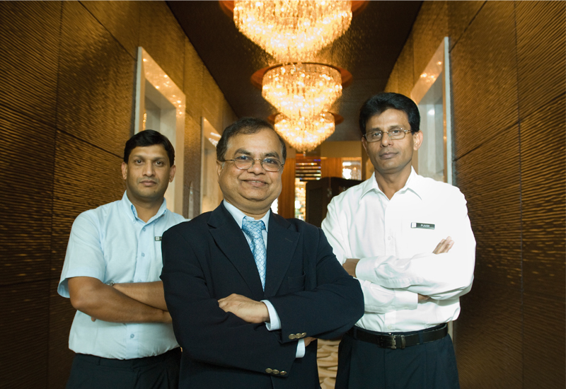 Madan Kulkarni, director of engineering, The Address, flanked by the hotel's AV staff Madan Kulkarni, director of engineering, The Address, flanked by the hotel's AV staff
