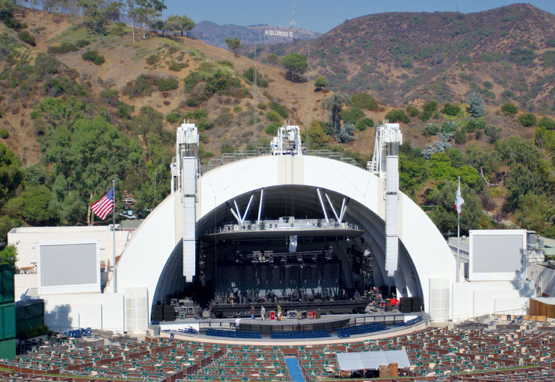 THE HOLLYWOOD BOWL (Los Angeles, USA) The Hollywood Bowl is known for its band shell, a distinctive set of concentric arches that graced the site from 1929 through 2003, before being replaced with a somewhat larger one beginning in the 2004 season. The shell is set against the backdrop of the Hollywood Hills and the famous Hollywood sign to the Northeast. The THE HOLLYWOOD BOWL (Los Angeles, USA) The Hollywood Bowl is known for its band shell, a distinctive set of concentric arches that graced the site from 1929 through 2003, before being replaced with a somewhat larger one beginning in the 2004 season. The shell is set against the backdrop of the Hollywood Hills and the famous Hollywood sign to the Northeast. The