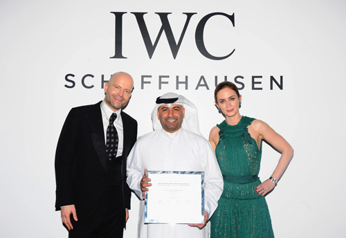 Emily Blunt presents the IWC Award 2014 to Abdullah Boushahri. Emily Blunt presents the IWC Award 2014 to Abdullah Boushahri.