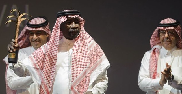 Saudi actor Saed Khader waves his honour award for his achievements at the opening ceremony of the fourth Saudi Film Festival. (AFP/Getty Images) Saudi actor Saed Khader waves his honour award for his achievements at the opening ceremony of the fourth Saudi Film Festival. (AFP/Getty Images)