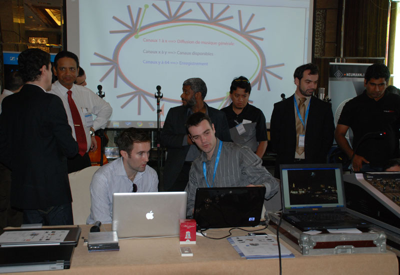 Emmanuel Denoyer (seated right) talks about AES42 solutions to one of the attendees. Emmanuel Denoyer (seated right) talks about AES42 solutions to one of the attendees.