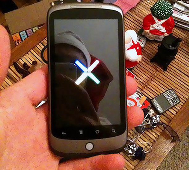Google employee Queiroz donned a Santa's hat in his reveal of the Google smartphone. Google employee Queiroz donned a Santa's hat in his reveal of the Google smartphone.