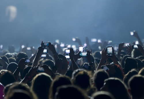 Are we becoming a generation of phone-filming addicts? (Image: Shutterstock) Are we becoming a generation of phone-filming addicts? (Image: Shutterstock)