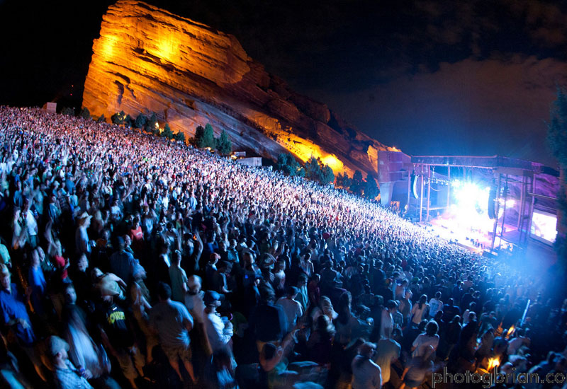 RED ROCKS AMPHITHEATRE (Colorado, USA) Once named as one of the Seven Wonders of the World, the Red Rocks Amphitheatre is made up of two three-hundred foot sandstone monoliths, set along the Rocky Mountain Foothills. The naturally formed venue got its official start in 1906 when visionary John Brisben Walker held the first concert. In 1927, the city of Denver purchased the land and its breathtaking open-air stage has been successful ever since. Red Rocks has been a popular venue for live recordings, particularly videos due to the visual uniqueness of the setting. During the 1970s and 1980s, local folk-rocker John Denver recorded several world-televised concerts at Red Rocks. U2's 1983 concert video, Live at Red Rocks: Under a Blood Red Sky, became a best-selling long-form concert video and several songs became popular music videos. RED ROCKS AMPHITHEATRE (Colorado, USA) Once named as one of the Seven Wonders of the World, the Red Rocks Amphitheatre is made up of two three-hundred foot sandstone monoliths, set along the Rocky Mountain Foothills. The naturally formed venue got its official start in 1906 when visionary John Brisben Walker held the first concert. In 1927, the city of Denver purchased the land and its breathtaking open-air stage has been successful ever since. Red Rocks has been a popular venue for live recordings, particularly videos due to the visual uniqueness of the setting. During the 1970s and 1980s, local folk-rocker John Denver recorded several world-televised concerts at Red Rocks. U2's 1983 concert video, Live at Red Rocks: Under a Blood Red Sky, became a best-selling long-form concert video and several songs became popular music videos.