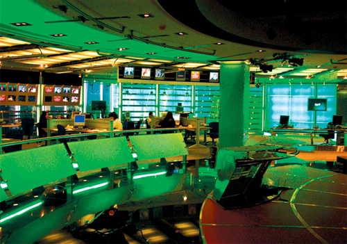 A look at the old studio with smaller monitors and fluorescent lighting and the new one that uses LED colour changing lights and Barco projectors. A look at the old studio with smaller monitors and fluorescent lighting and the new one that uses LED colour changing lights and Barco projectors.