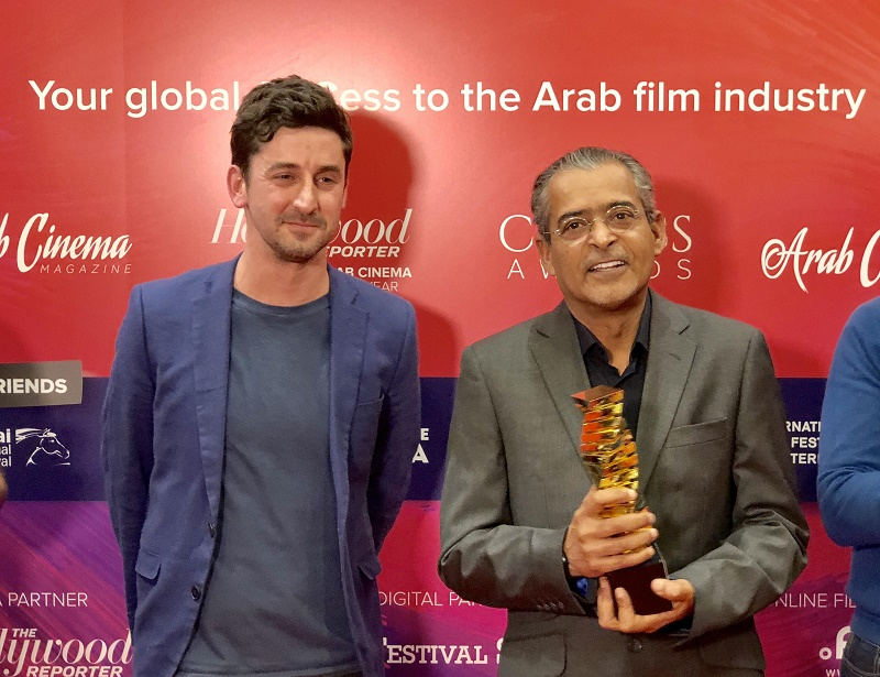 DIFF Chairman Abdulhamid Juma presented the award by Hollywood Reporter's Alex Ritman DIFF Chairman Abdulhamid Juma presented the award by Hollywood Reporter's Alex Ritman