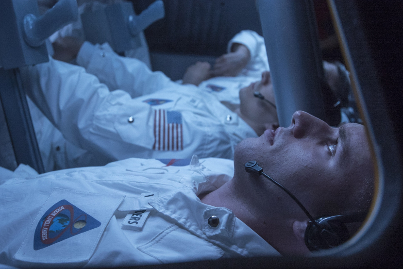 Reenactment of Astronaut Bill Anders foreground in the Apollo 8 control module on December 23 1968. Reenactment of Astronaut Bill Anders foreground in the Apollo 8 control module on December 23 1968.