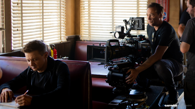 Jeremy Renner in the Jeep commercial with Jordan Levy in the background. Jeremy Renner in the Jeep commercial with Jordan Levy in the background.