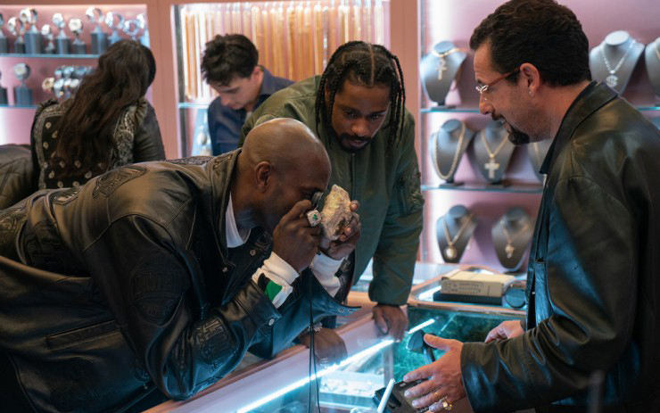 Uncut Gems, the latest movie directed by the Safdie Brothers stars Adam Sandler as a New York City jeweler and gambler. Uncut Gems, the latest movie directed by the Safdie Brothers stars Adam Sandler as a New York City jeweler and gambler.